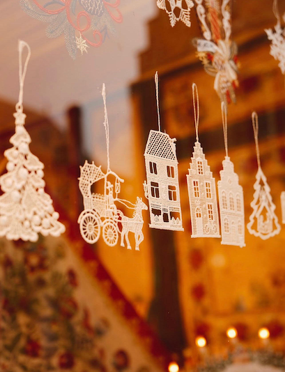 Christmas dollies hanging in a window