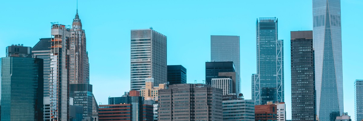 Modern New York City skyline with tall skyscrapers under a clear blue sky
