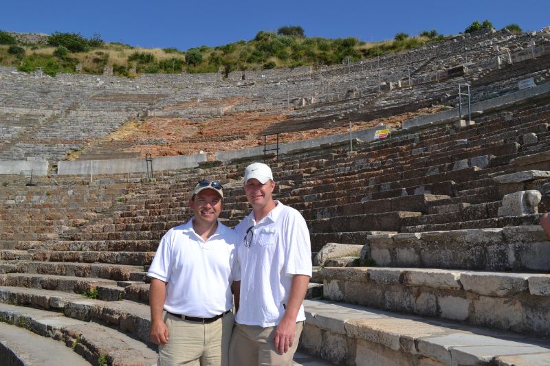 Tourists standing inside Roman amphitheater at Ephesus archaeological site in Turkey